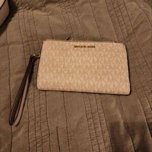 Pink Michael Kors clutch wallet